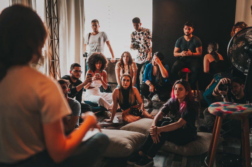 A group of people sitting on the floor