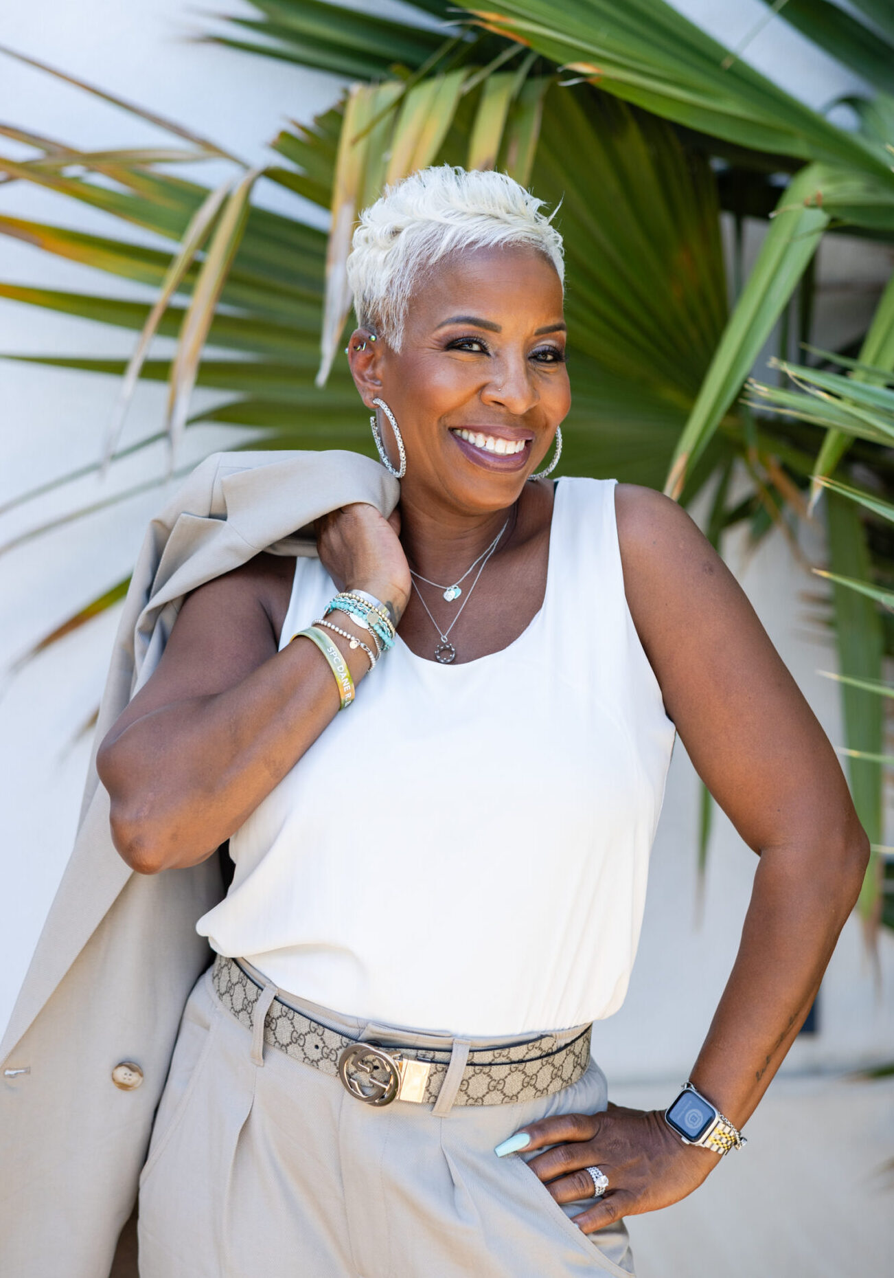 A woman with short hair is posing for the camera.