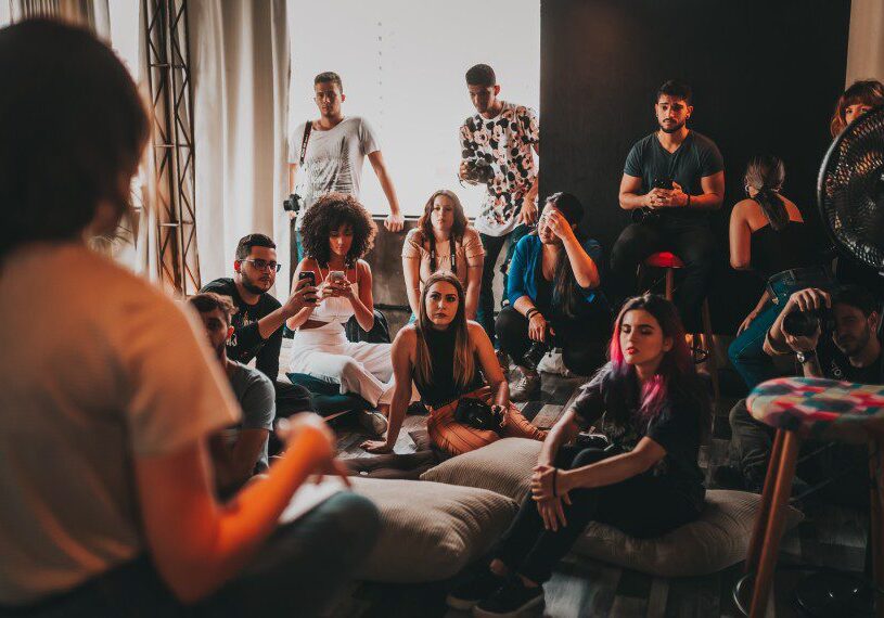 A group of people sitting on the floor